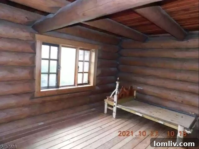 Unfinished bedroom interior of the log cabin with natural wood elements