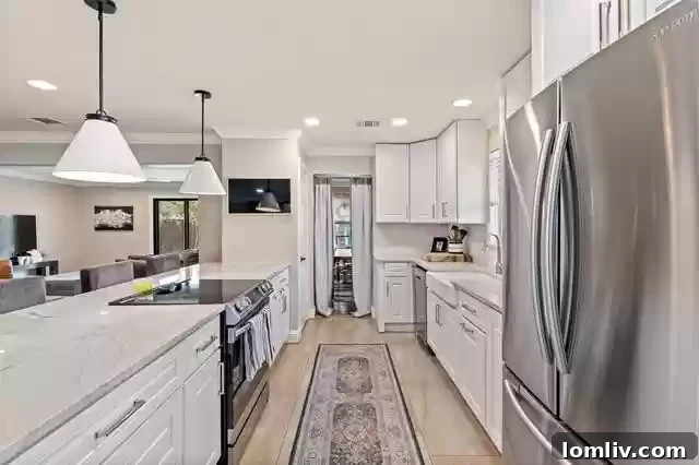 Sparkman Club Estates: Your Turnkey Home in a Welcoming Community 7 Modern Kitchen with Marble Countertops - 10443 Royal Club Lane