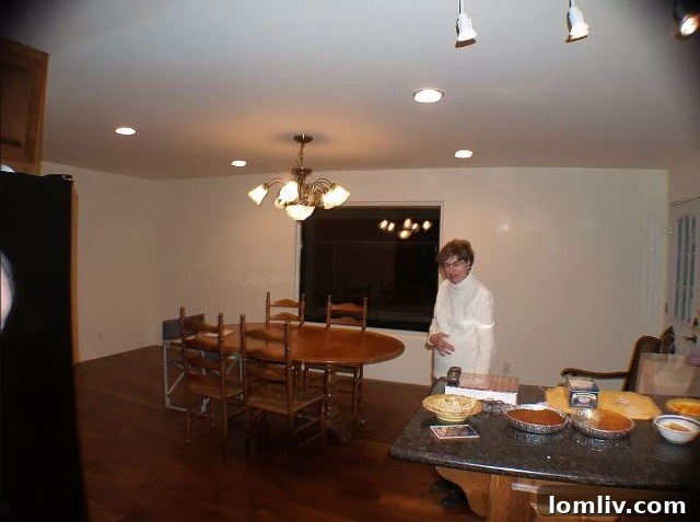 Woman with delicious pies in a home kitchen