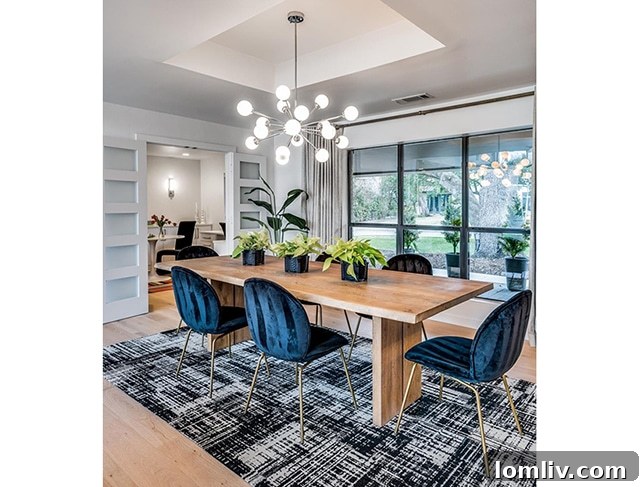 Great room with wood-beamed ceiling and modern fireplace