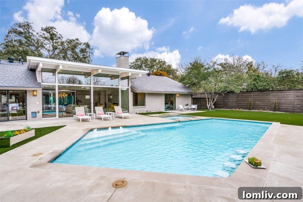 Luxury pool with underwater seating in a Dallas backyard