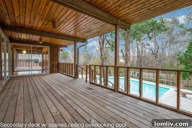 Exterior of Mid-Century Modern home at dusk, showcasing lighting