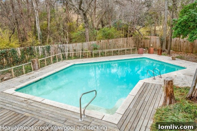 Another view of the Mid-Century Modern home's pool and deck area