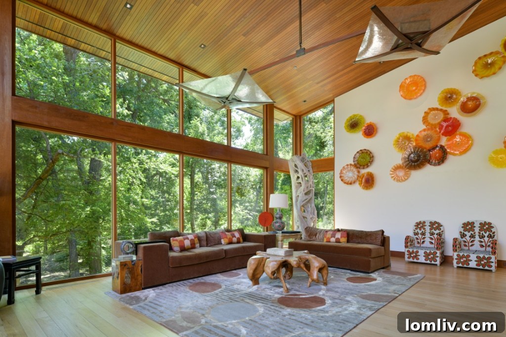 A panoramic shot of the living space extending outdoors, featuring minimalist design and abundant natural light.