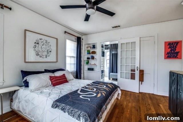 Living room showcasing local art by Lilco Studio and a blue plant stand