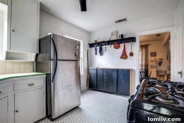 Front facade of the Austin Stone home with mature landscaping