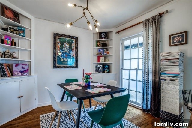 Modern gravel backyard with fire pit and dining area