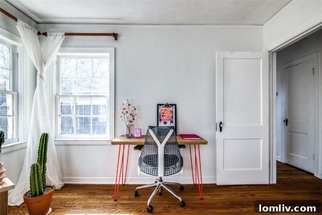 Dining room with built-ins, modern light fixture, and layered rugs
