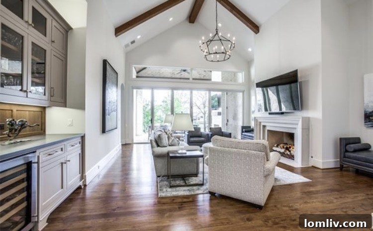 Upscale Open Houses: Your Dream Home Awaits This Weekend 4 Elegant living room with high vaulted ceilings and hickory wood floors in Dallas luxury home