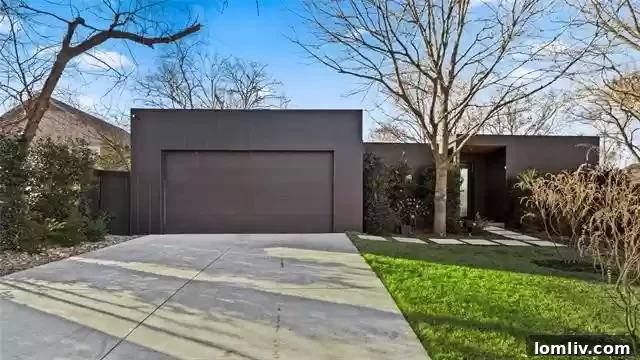Architectural front view of a modern luxury home at 8631 Daytonia Avenue in Little Forest Hills, Dallas