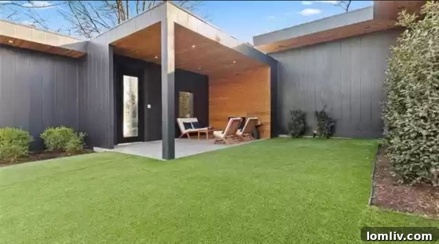 View of the front exterior of 8631 Daytonia Avenue showcasing lush landscaping and architectural design