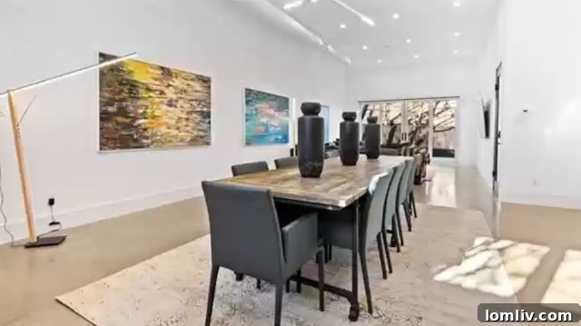 Interior view of a spacious living area or hallway with ample wall space, ideal for art display