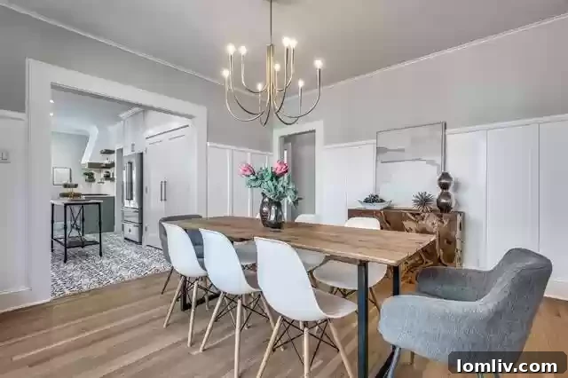 Modern kitchen with sage green cabinets and high-end appliances