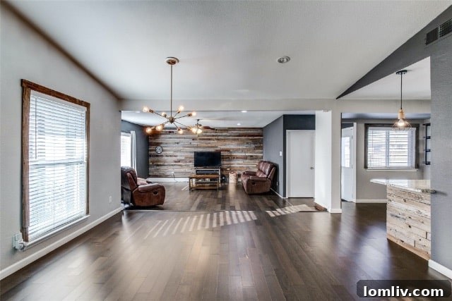Stylish dining room with a distressed wood accent wall, showcasing modern decor