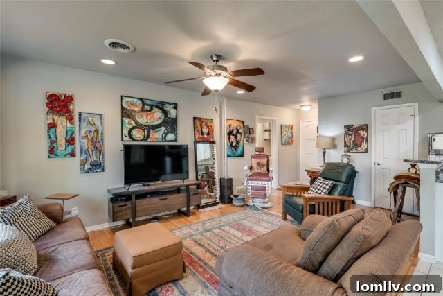 A vibrant and cleverly painted concrete floor in the garage conversion, serving as an artist's studio or versatile space.