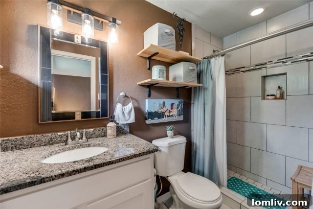 Exterior shot of the main house, showcasing its midcentury charm and large, inviting lot with ample parking.