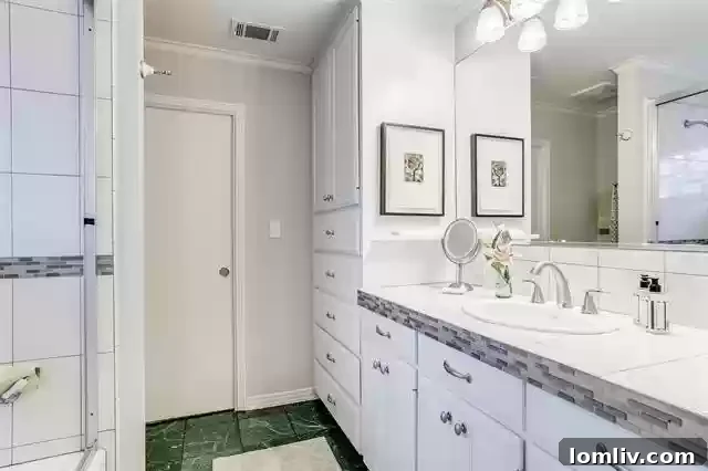 Bluffview Estates backyard with covered patio and green lawn