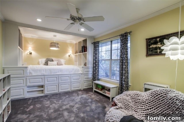 Another view of a children's bedroom showcasing custom built-in cabinetry and playful decor