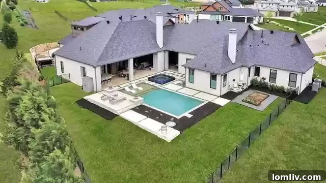 Farmhouse Chic with a City Twist The Ultimate Rural Retreat 12 Spectacular pool with fire and water features