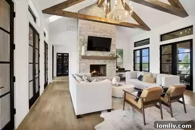Farmhouse Chic with a City Twist The Ultimate Rural Retreat 5 Elegant living area with a stone fireplace and high ceilings