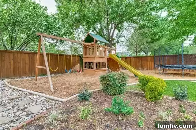 Sparkling blue diving pool and integrated spa in the private backyard of a luxury Southlake home