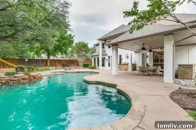 Expansive backyard with a lush green lawn, mature trees, and ample space for outdoor recreation