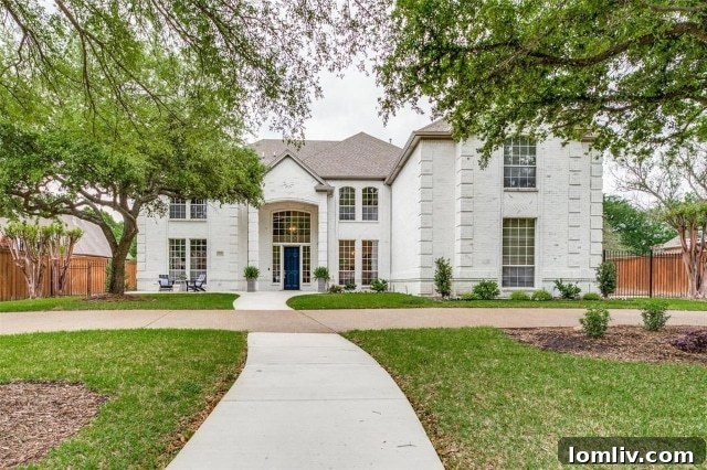 Luxurious Southlake home exterior showcasing elegant architecture and spacious grounds with a circular driveway
