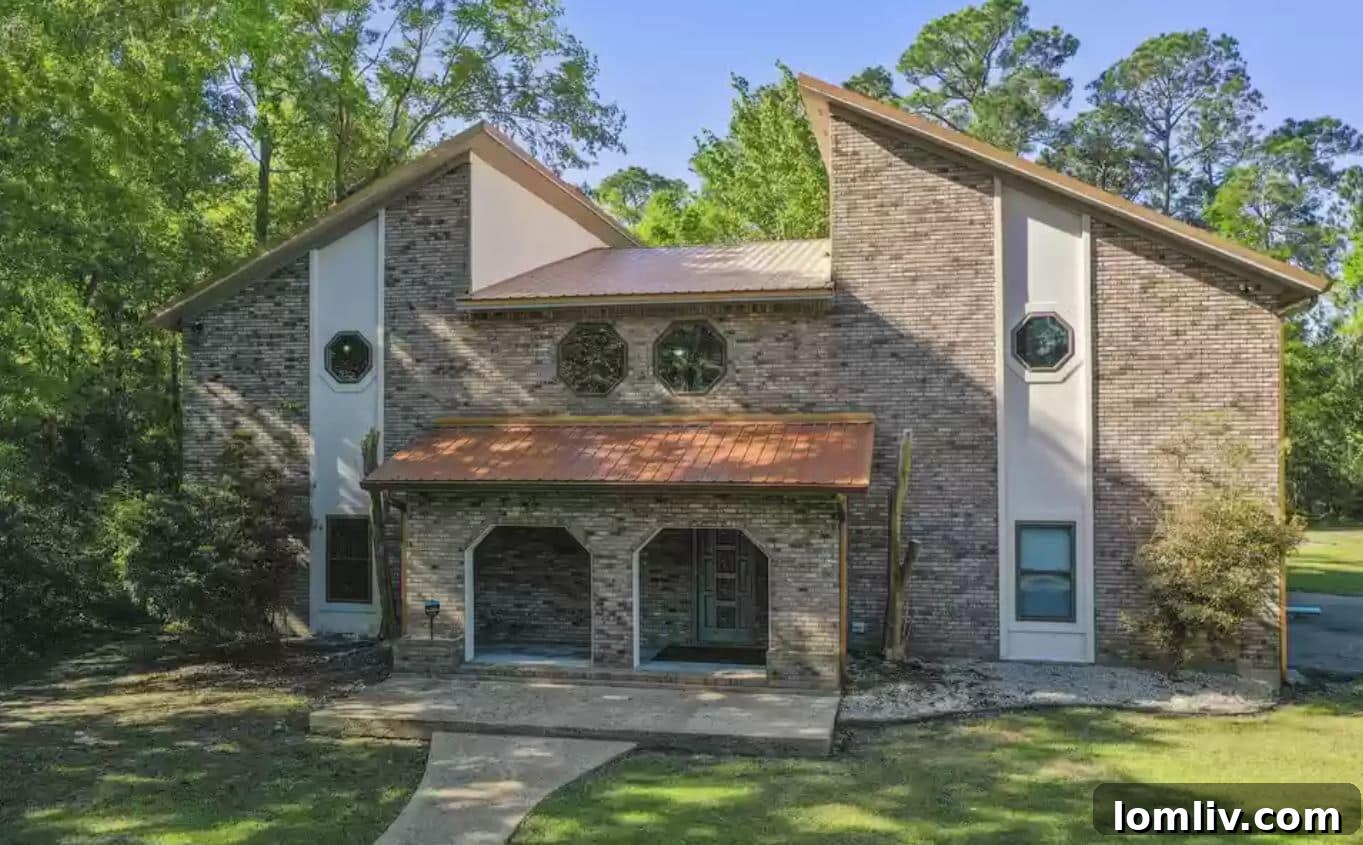 Discover the exterior and precise location of the geometrically designed mannequin house at 1711 Graveline Road, Gautier, Mississippi.