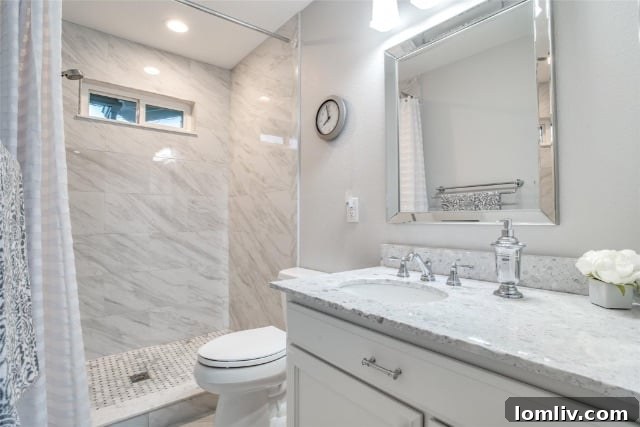 Stylish bathroom with hexagonal penny tile and modern fixtures