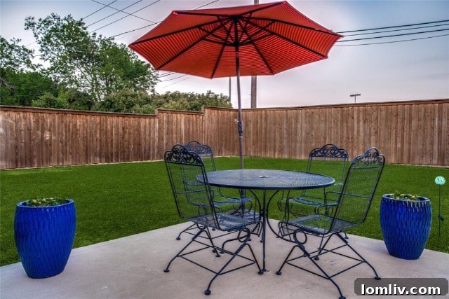 Cozy primary bedroom with custom blinds and ample natural light