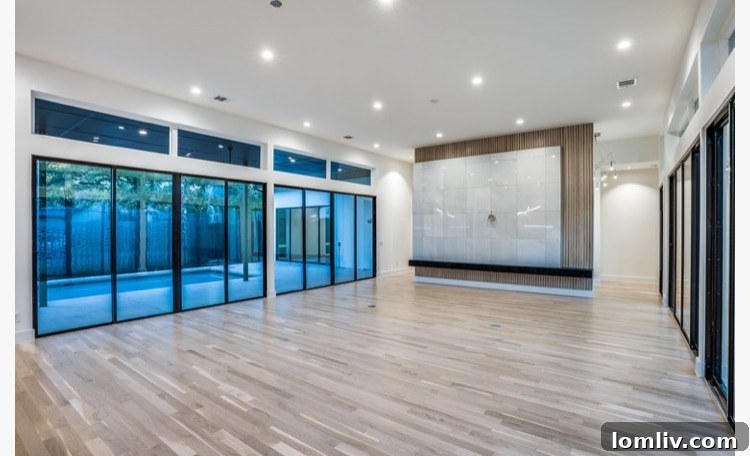 Contemporary C-shaped home exterior with central courtyard and pool at 4302 Bluffview Blvd.