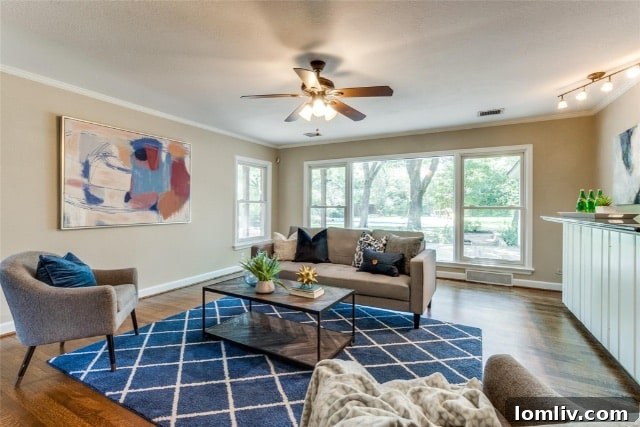 Exterior of the detached three-car brick garage with mature landscaping