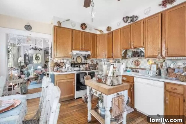 Refrigerator and Kitchen Cabinetry in a Busy Victorian Kitchen