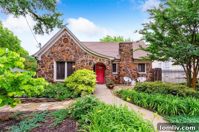 Front exterior of a classic stone Tudor home in Beckley Club Estates, showcasing its intricate stonework and inviting curb appeal