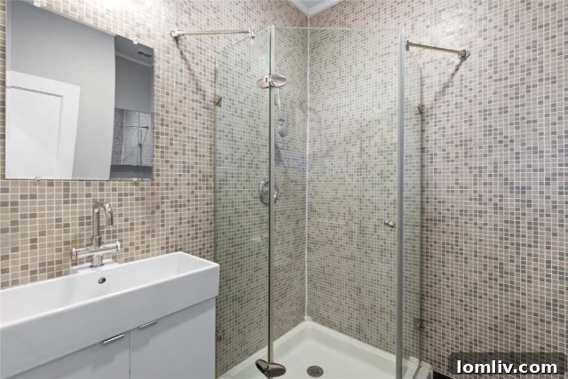 Dining area adjacent to the kitchen, showcasing refinished light hardwood floors, an open, airy feel, and abundant natural light