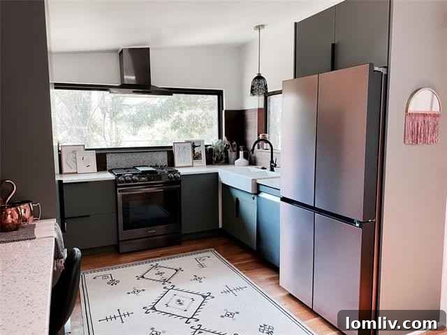 Dining area with a mod light fixture, part of the open-concept living space