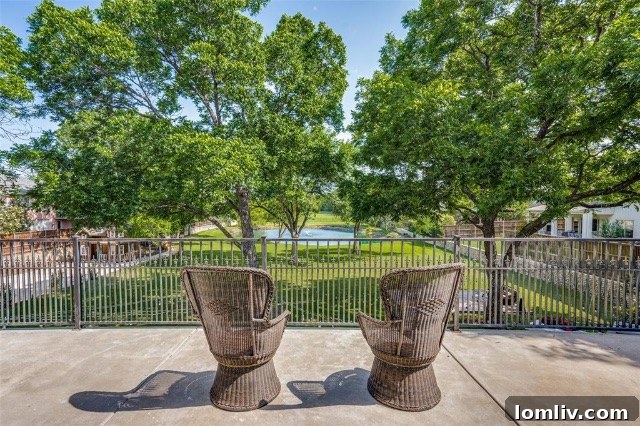 Second-Floor Balcony Overlooking the Grounds and Pond