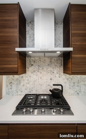 Modern kitchen under construction with new cabinets and appliances