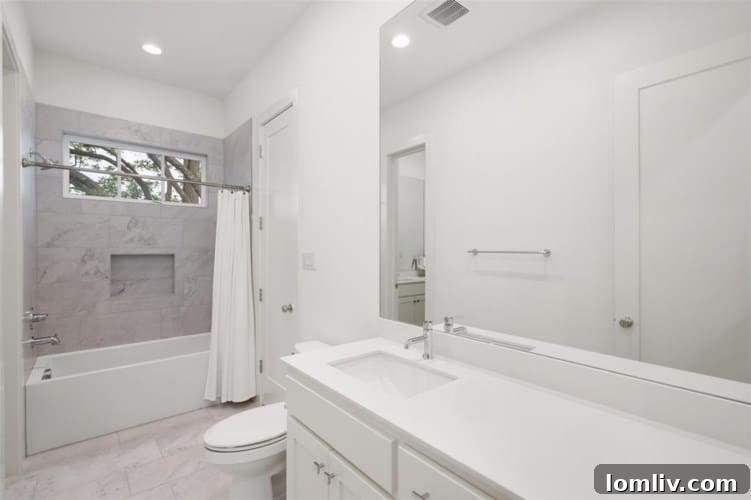 Stylish Jack and Jill Bathroom with Updated Tilework