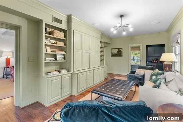 Powder room with ivy-patterned wallpaper and elegant fixtures