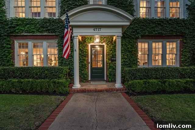 Front view of the Colonial Revival home in Fort Worth with manicured landscaping