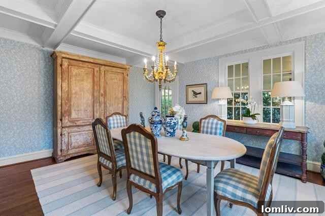 Elegant dining room with botanical wallpaper and hardwood floors