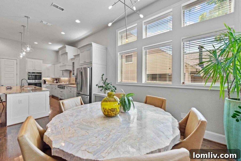Elegant open-plan living space with high ceilings and abundant natural light