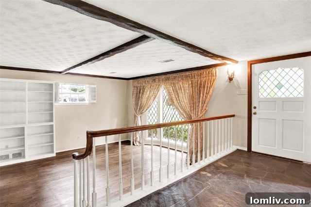 Expansive and private backyard of the Garland property, featuring mature trees and ample space for outdoor activities