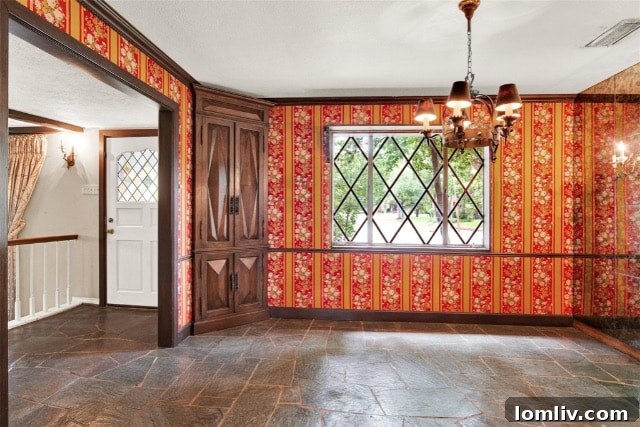 Inviting front exterior of the Garland gingerbread house, with a convenient wraparound driveway and neatly kept garden