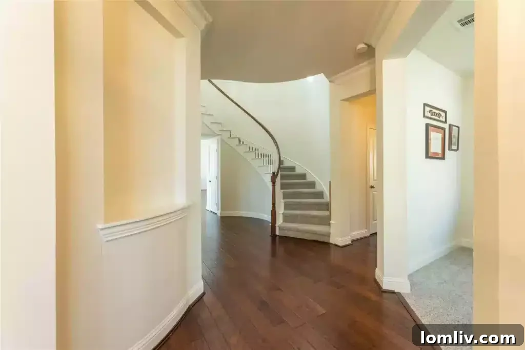 Elegant living room with built-in speakers and engineered hardwood floors at 2450 Chesapeake Drive