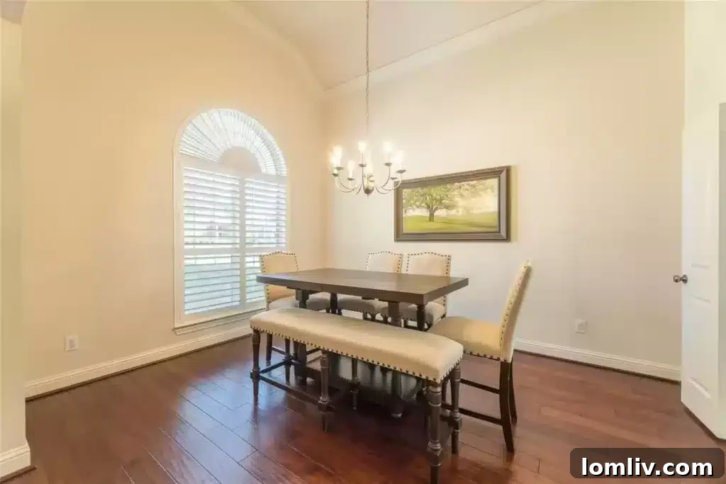 Spacious kitchen with original cabinetry and ample counter space, meticulously maintained