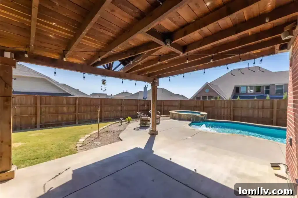 Inviting swimming pool and hot tub in the meticulously landscaped backyard of 2450 Chesapeake Drive