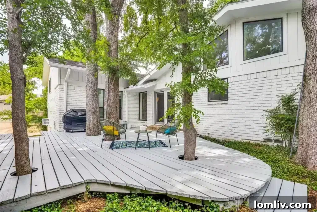 White Rock Elementary: A Galactic Home for Growing Minds 11 A spacious backyard surrounded by mature trees, offering privacy and room for recreation.