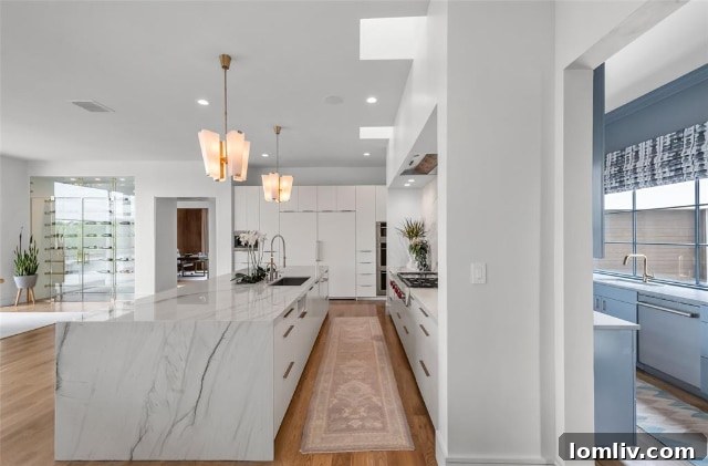 Modern Galley Prep Kitchen Adjacent to Main Entertaining Area